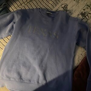 “Texas” purple crew neck.
